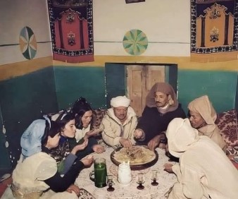 Moroccan family around couscous dinner